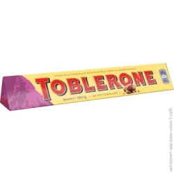 Toblerone Шоколад молочний з родзинками і нугою 100 г