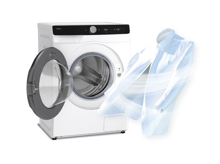 The door of the washing machine is open and air stream is surrounding shirts.